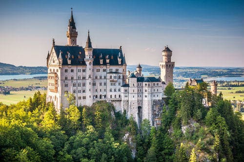 _beautiful_view_of_world-famous_neuschwanstein_castle_the_19th_century_romanesque_revival_palace_built_for_king_ludwig_ii_in_beautiful_evening_light_at_sunset_fussen_southwest_bavaria_germany