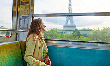 france-paris-woman-in-metro-looking-at-eiffel-tower